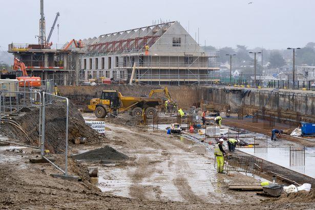 Workers are digging two underground car parks